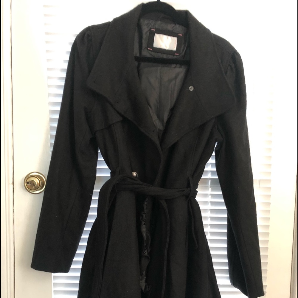 Black coat with ruffle detail